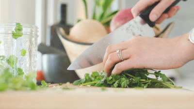 Person chopping herbs
